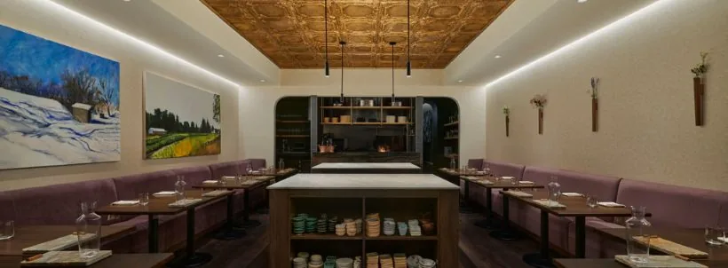 Feld dining room with a long central table and wall-side seating