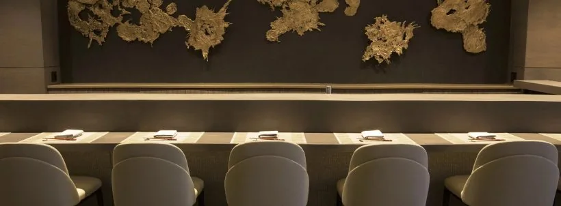 Mako sushi counter with pale upholstered chairs