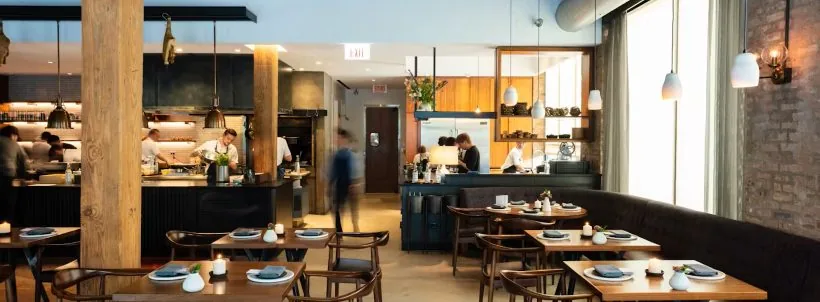 Dining tables and an open kitchen at Smyth